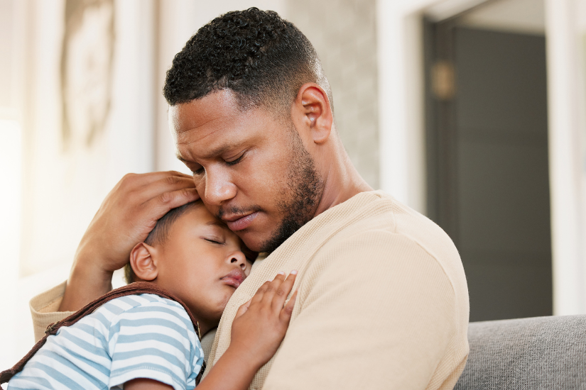 a father hugging his son.